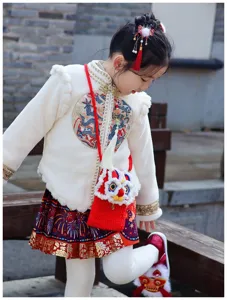 Cute lion dance crochet children cross-body bag detail view, winter style cute red pouch.