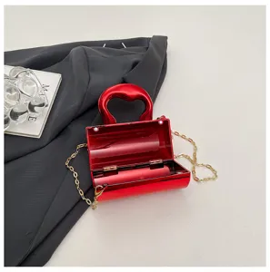 Glossy PVC cylinder women handbag with chain strap, stylish mini shoulder crossbody bag.