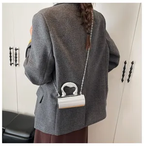 Stylish minimalist glossy PVC cylindrical women's shoulder bag with chic chain strap.