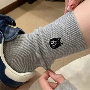 Grey ribbed slouch socks for women, cute colorful flecks knit with black cat embroidery detail.