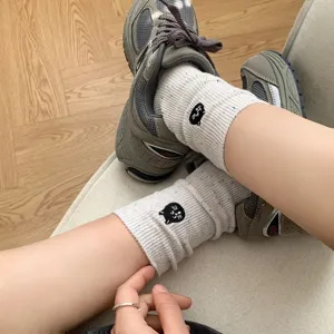 Cute black cat embroidery women mid-tube socks with colorful flecks for autumn winter.