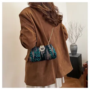 Sequins evening bag detail, elegant chain shoulder bag with rhinestone ring clasp for party.