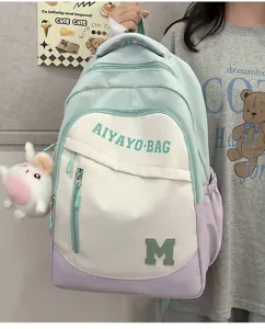 Großer kapazität farbblock schüler rucksack mit süßem hasenanhänger für schule und freizeit.