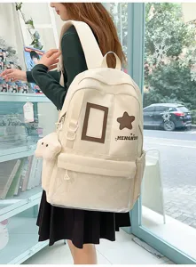 Close-up detail view of Japanese style canvas backpack with transparent pocket and star patch.