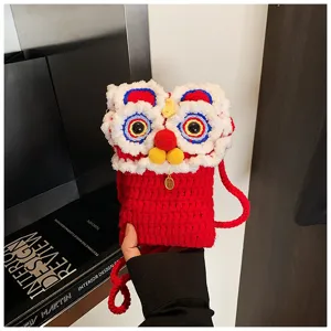 Handmade knitted lion dance kids phone bag detail, cute red cross-body mini bag for winter.