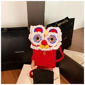 Cute crochet lion dance crossbody bag for kids, red knitted phone pouch with plush details.