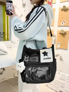 Sac cabas en toile noire avec une poche transparente, patch étoile et joli pendentif.