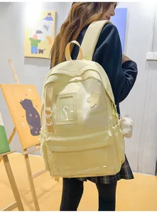 Detail shot of the light yellow Japanese style student backpack with clear pocket and star patch.