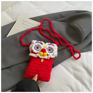 Cute lion knit phone bag for kids, cozy red winter crossbody bag with shoulder strap.