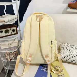 Sac a dos d'ecolier de style campus japonais de grande capacite pour etudiants design jaune.