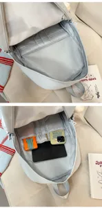 Detailed view of the large capacity grey backpack interior pockets and compartments storage.
