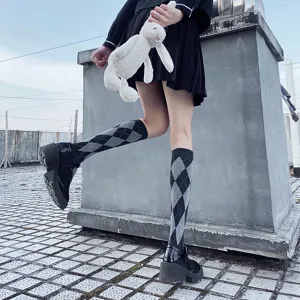 Argyle knee-high socks detail view, classic black and white diamond pattern for daily wear.