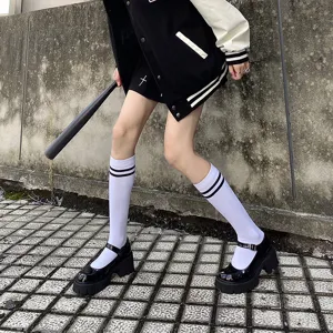 Japanese style black mid-calf socks for women, perfect for daily wear and school outfits.