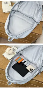 Sac à dos scolaire bleu clair vue détaillée de l'intérieur avec compartiments multiples