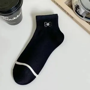 Women black short socks with cute white camellia flower embroidery and toe stripe main view