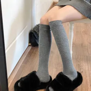 Grey ribbed knee high socks for women, winter warm long boot socks and cute leg warmers.