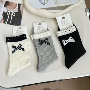 Korean ins style women mid tube socks with double layer rib and cute polka dot bow design.