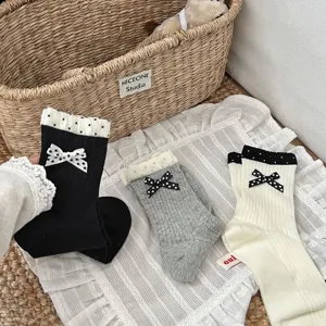 Ruffle bow socks detail view, Korean style ins cute polka dot cotton mid tube slouchy socks.