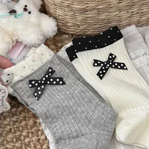 Korean style women mid-tube cotton socks with polka dot bow and double cuff details