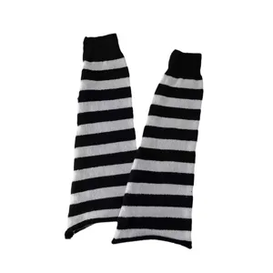 Black and white striped knitted leg warmers, cozy Y2K style knit boot cuffs for women fashion.