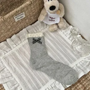 Korean style grey cotton mid-calf socks with black polka dot bow and double ruffle cuff for women.