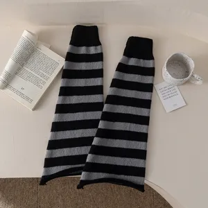 Black and grey striped knit leg warmers, cozy Y2K subculture slouchy winter socks for women.