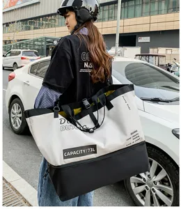 Outdoor travel duffel bag detail showing large capacity and stylish color-block design.