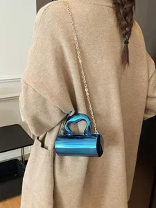 Chic metallic cylinder crossbody bag for women, trendy mini shoulder bag with chain strap.