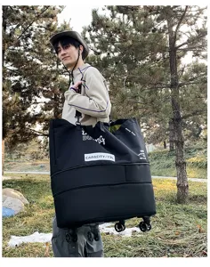 Outdoor lifestyle detail shot of a large capacity travel duffel bag with wheels in park.