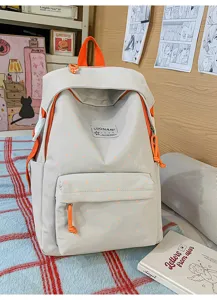 Detailansicht des süßen japanischen Polka-Dot-Rucksacks in Grau und Orange für Schülerinnen.