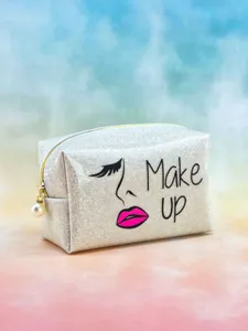 Glitter makeup bag detail showing sparkling sequin texture, golden zipper and elegant pearl pendant.