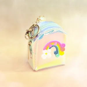 Detailed view of the holographic clear mini backpack coin purse featuring a cute rainbow cloud.