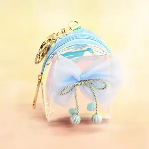 Holographic mini backpack keychain with mesh bow, cute iridescent coin purse pendant.