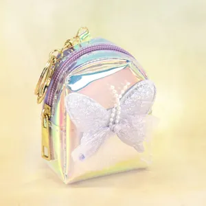 Iridescent mini backpack coin purse with cute butterfly pearl decor and keychains.