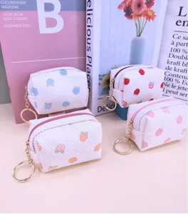 Waffle texture small coin purse with cute fruit print and metal keychain for lipstick storage.