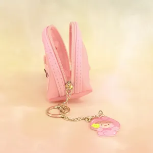 Mini pink PVC coin purse keychain with cute character pendant and secure zipper closure.
