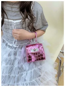Pink metallic crocodile texture mini girls handbag with top handle and stylish turn lock design.