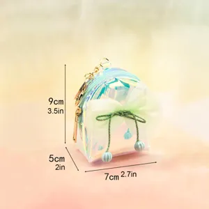 Laser iridescent mini backpack coin purse featuring mesh bow and cute keychain detail.