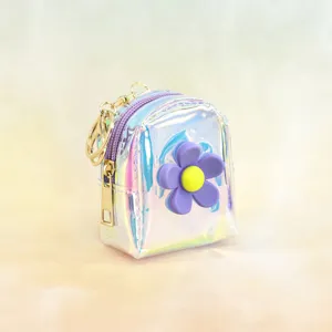Holographic mini backpack keychain, cute iridescent coin purse with purple flower charm.