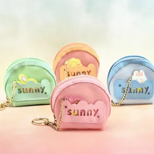 Mini macaron PVC coin purse with keychain chain, cute semi-circular portable pouch.