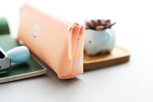 Cute silicone pencil case with cat pattern, soft aesthetic stationery bag for school students.