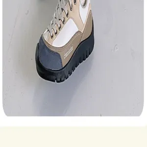 Vue détaillée d'une sneaker décontractée avec design color-block et semelle épaisse.