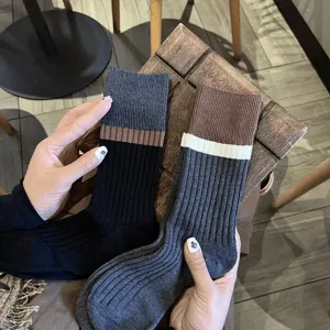 Detailed view of Japanese retro color-block striped mid-calf socks for women autumn winter