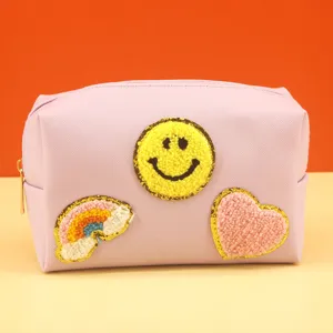 Cute purple cosmetic bag with cute smiley face rainbow and heart patch for women daily use.