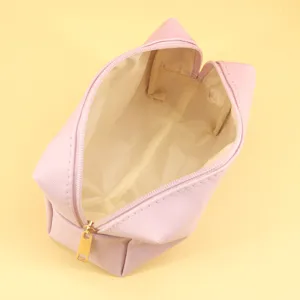 Pink cosmetic makeup bag detail view showing smooth zipper open structure for daily organization