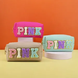 Cute multi-color cosmetic storage bag with fluffy chenille letters and portable design.