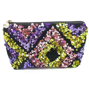 Detailed view of the sequin cosmetic pouch featuring colorful geometric embroidery and pearl pull.