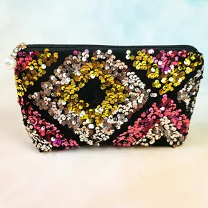 Sequin cosmetic bag with zipper and pearl pendant, fashionable trapezoid makeup storage pouch.