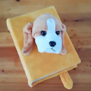 Close-up view of the cute plush puppy head detail on the soft yellow photo album cover.