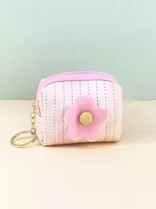 Closeup detail of the cute pink gradient mini coin purse with fluffy flower and keychain.